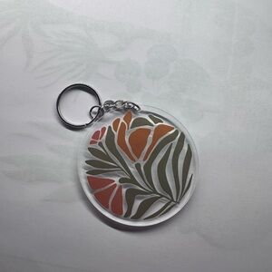 Floral Keychain with Orange and Green Design